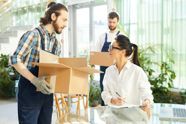 female entrepreneur talking to movers